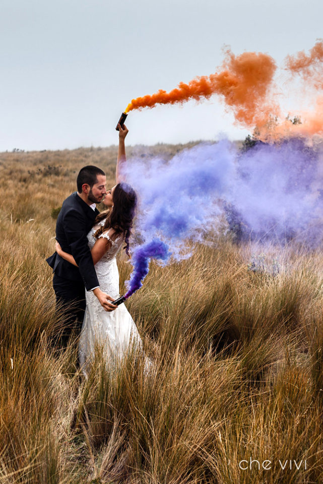 Couple with smoke bombs at mountain Ecuador
