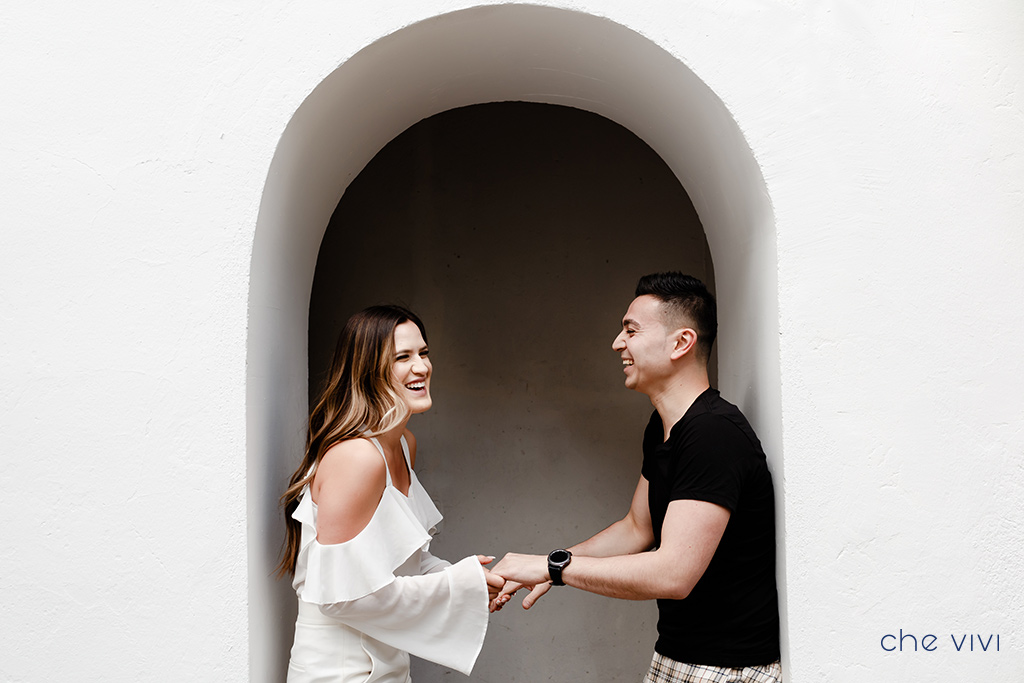 Couple-plays-with-hands-at-Guapulo-Park-engagement-photos-Quito