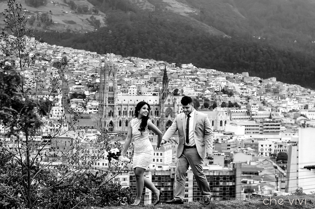 Couple walking with Oldtown Quito on the background